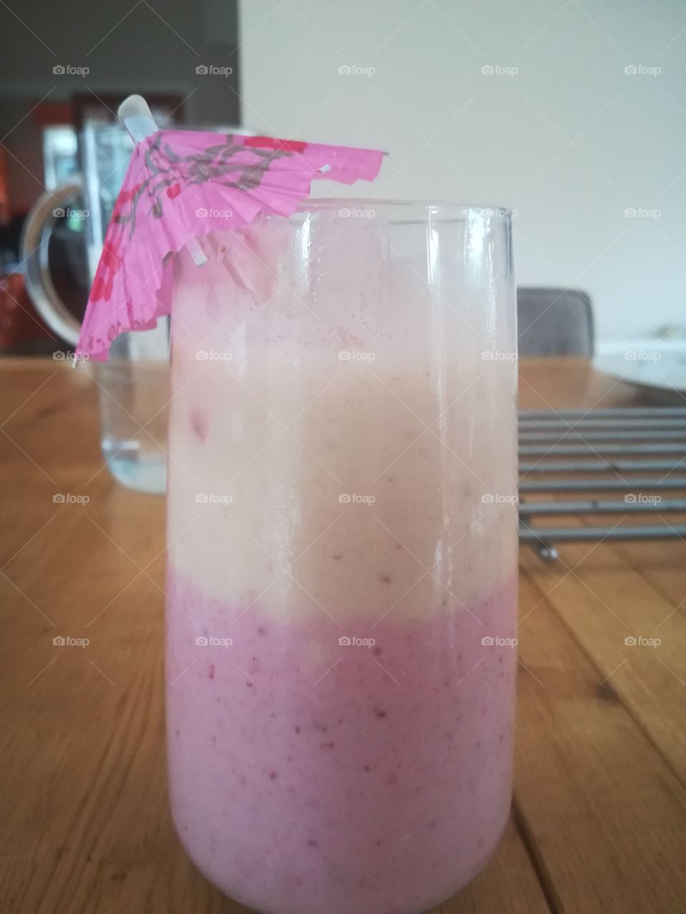 Homemade banana and strawberry milkshake  - but with an umbrella!