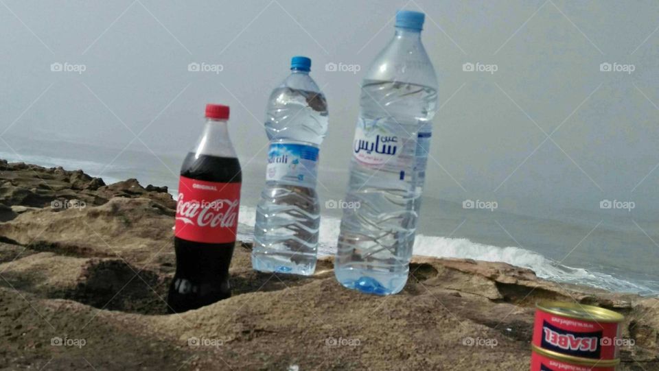 Bottles of water and cocacola.