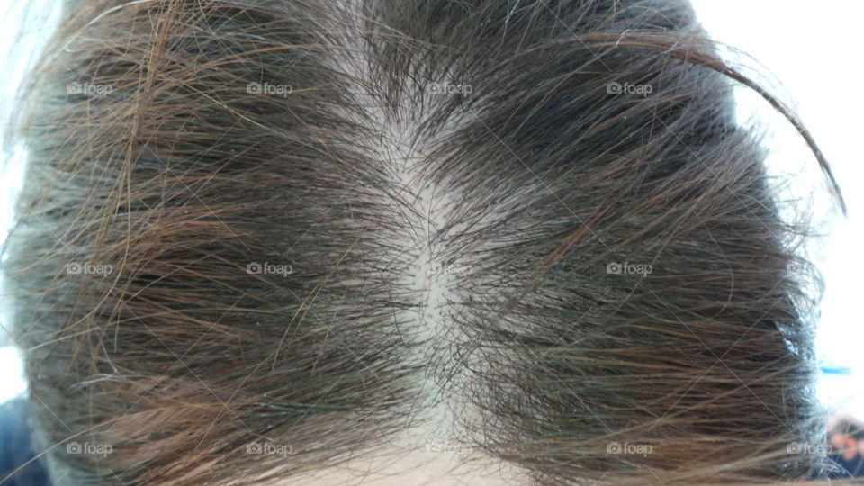 hair parting of a middle aged mother