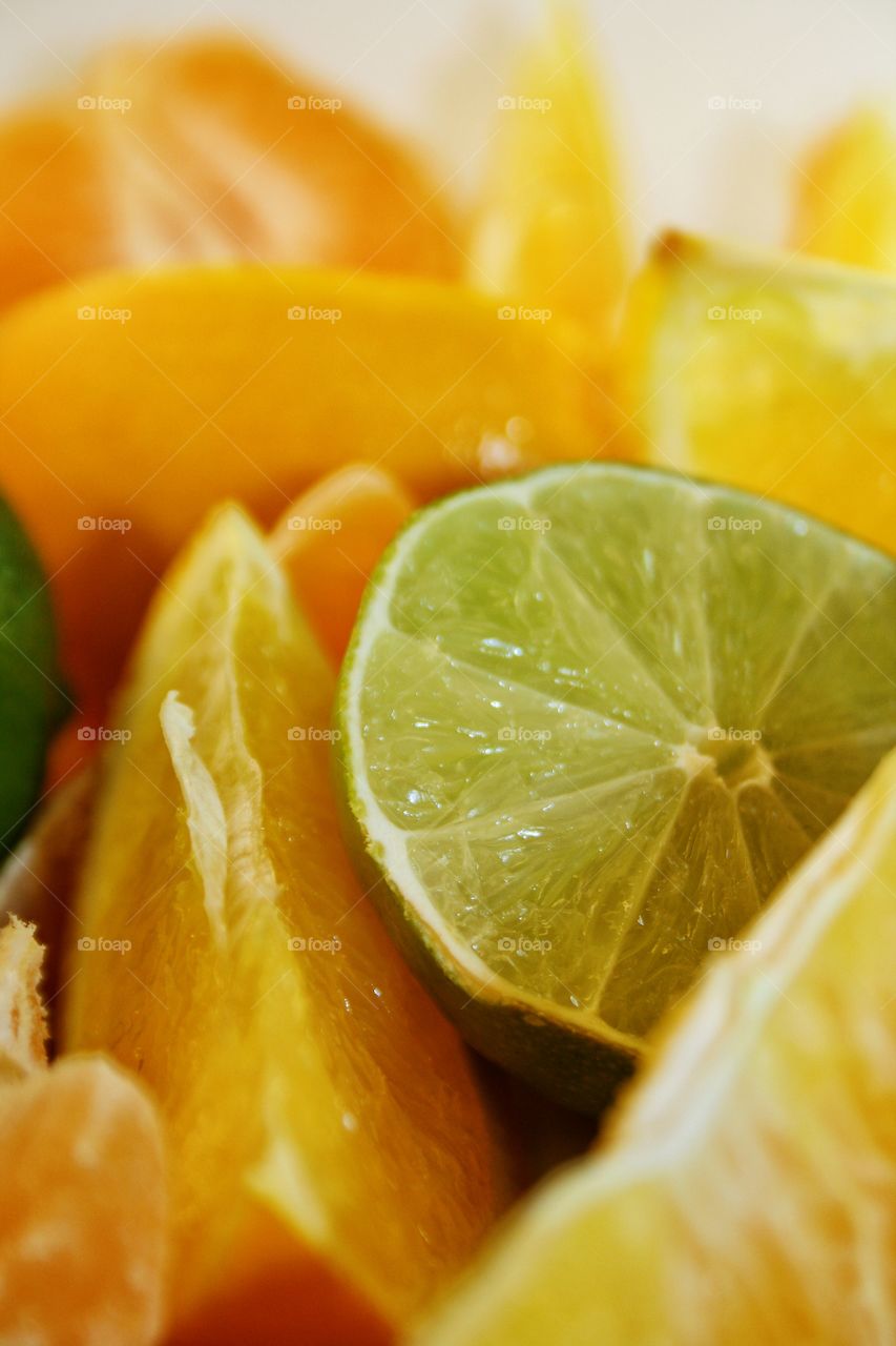 Sliced ​​fruits on white table