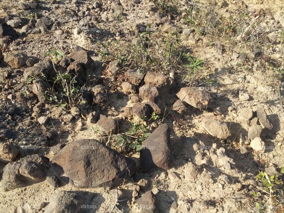 A beautiful scene of stones in the hill's edge.