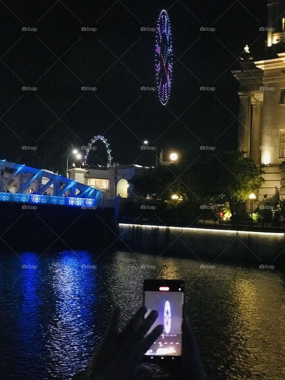 Led clock showing in the sky countdown to new year near Fullerton hotel in Singapore 