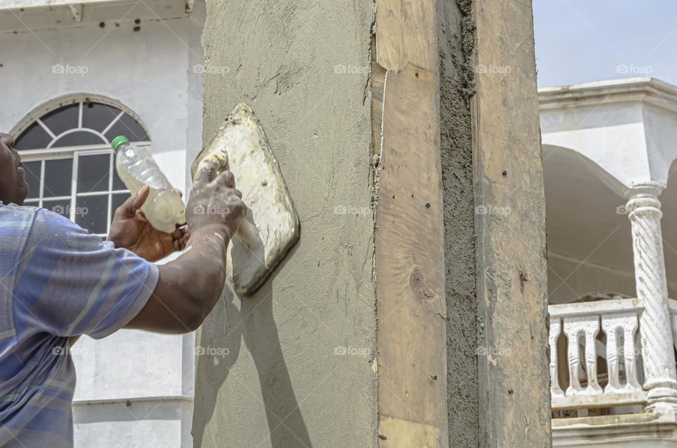 Man Using Float To Render Wall