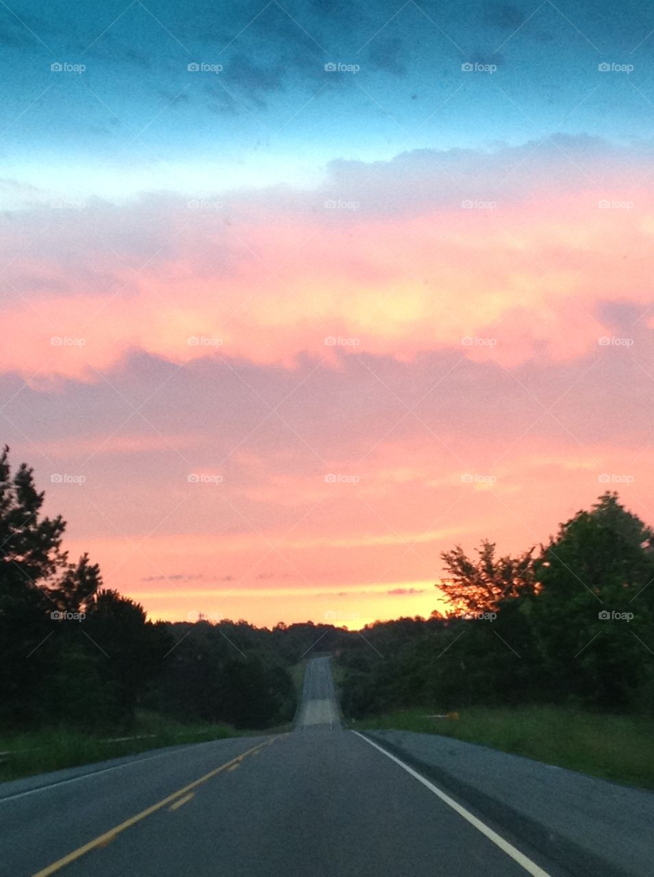 Road and sunset. 