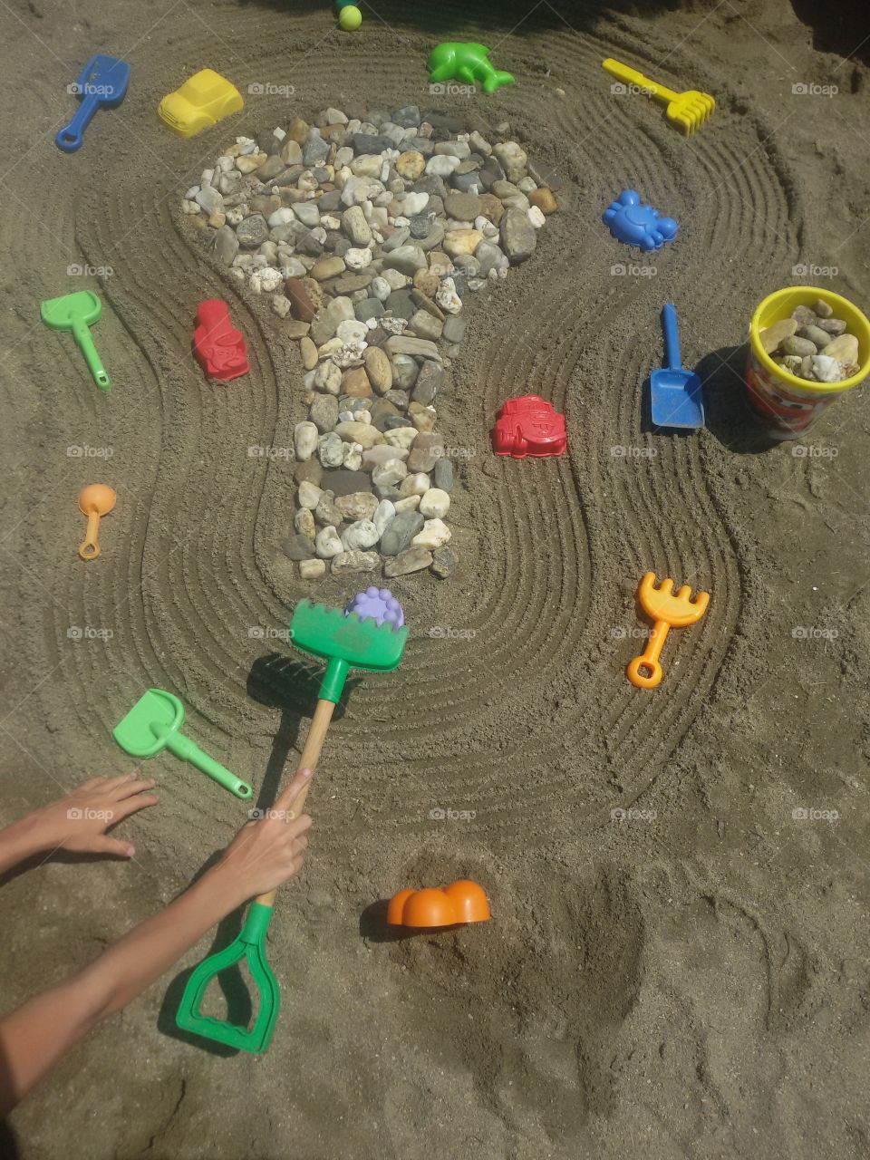 Children with toys on beach