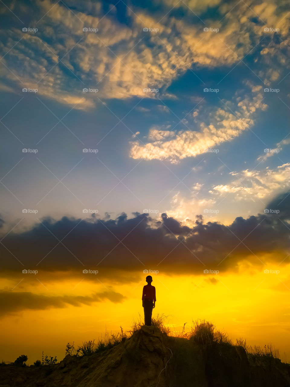 A man standing on the Spink Viewing Spot admiring the sunrise in Wicklow Ireland