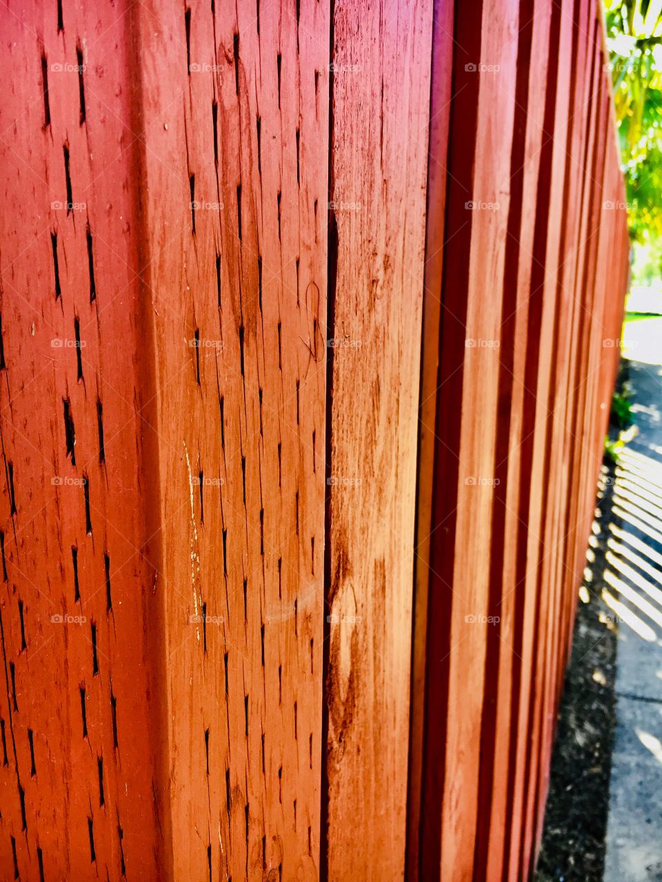 Red fence paint wood slats boards posts