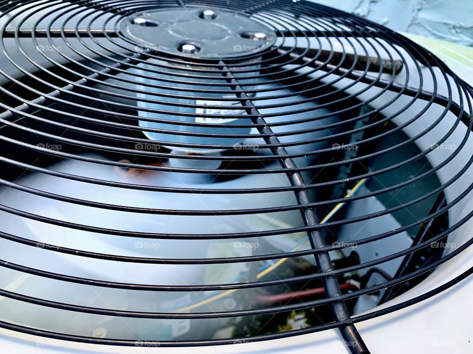 Large Outdoor Fan Central Air Conditioning System Spinning And In Function Seing The Wires And Parts Inside With Spinning Speed.