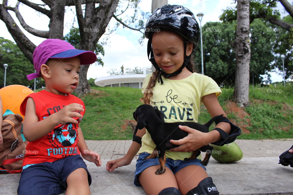 children playing with a dog