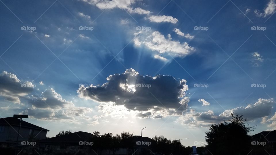 sun hiding behind cloud