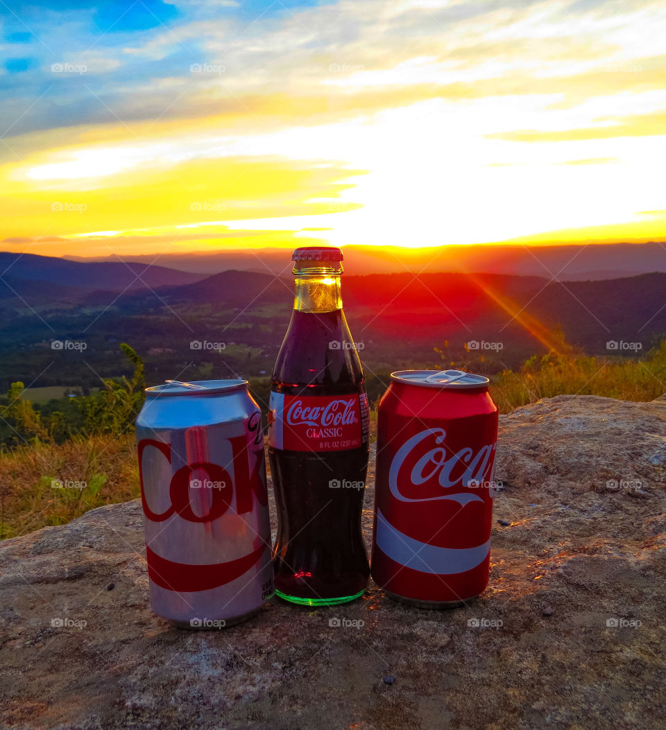 Coca Cola at sunset in the mountains.