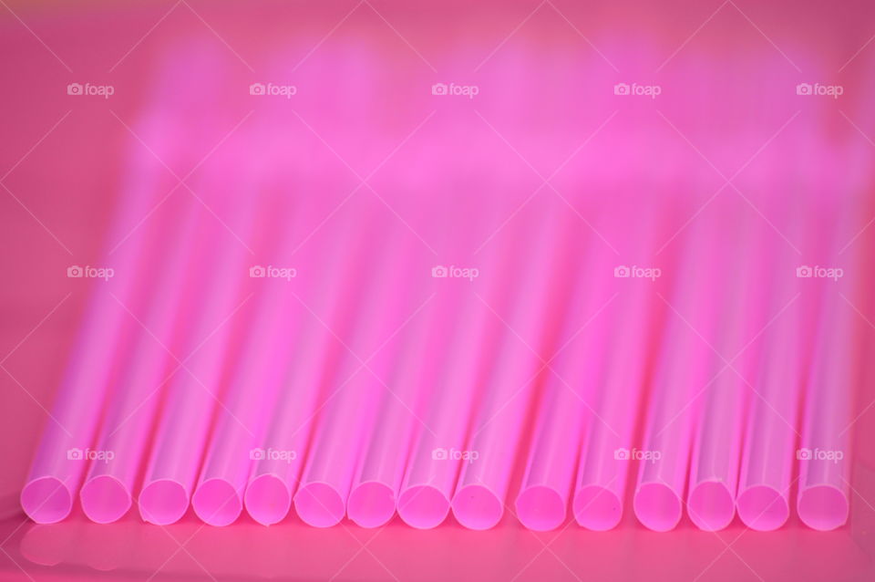 Close-up of a drinking straw in a row