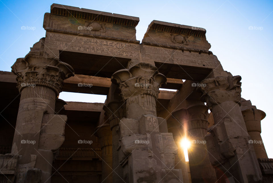 Blessed Sunrise. Sunrise peeks in through the pillars of Kom Ombo. Egypt.