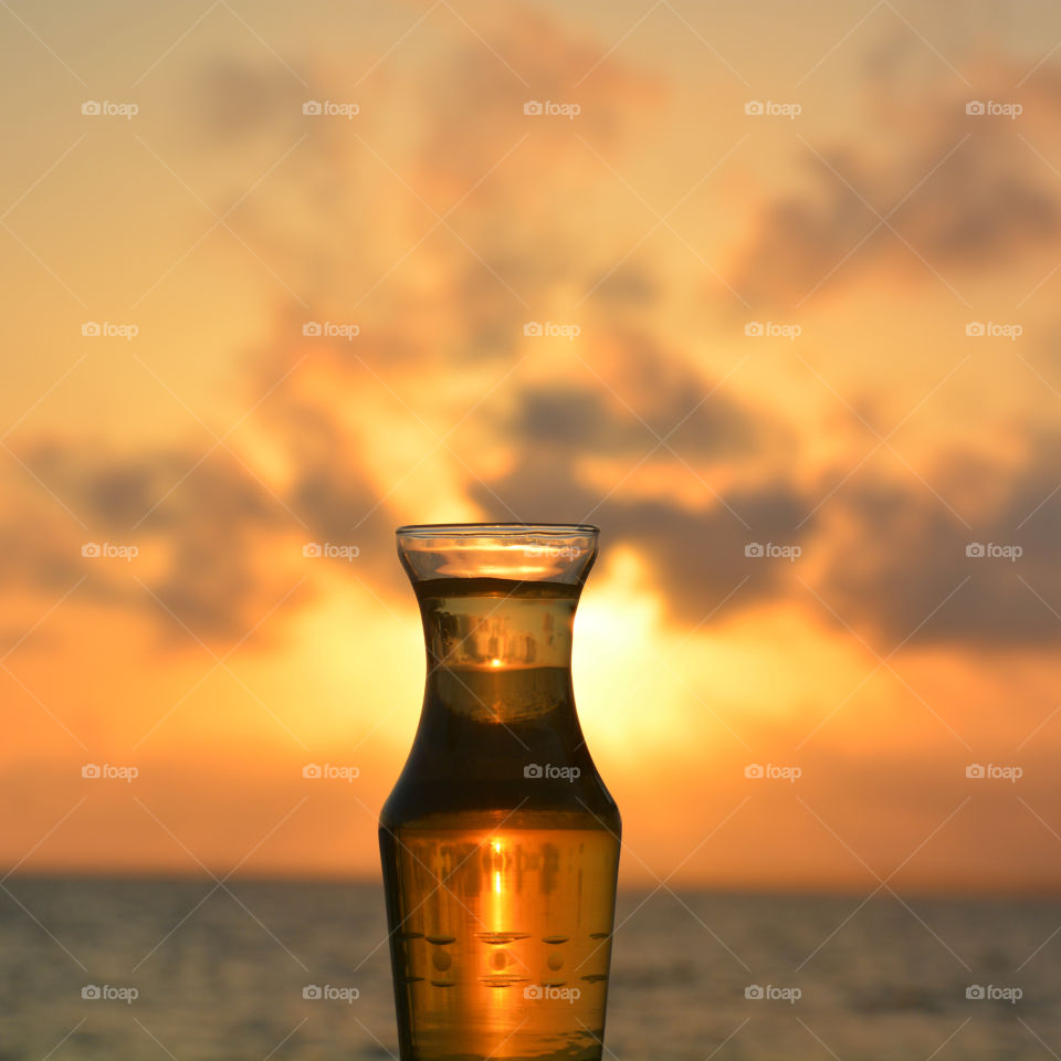 Glass bottle at sunset