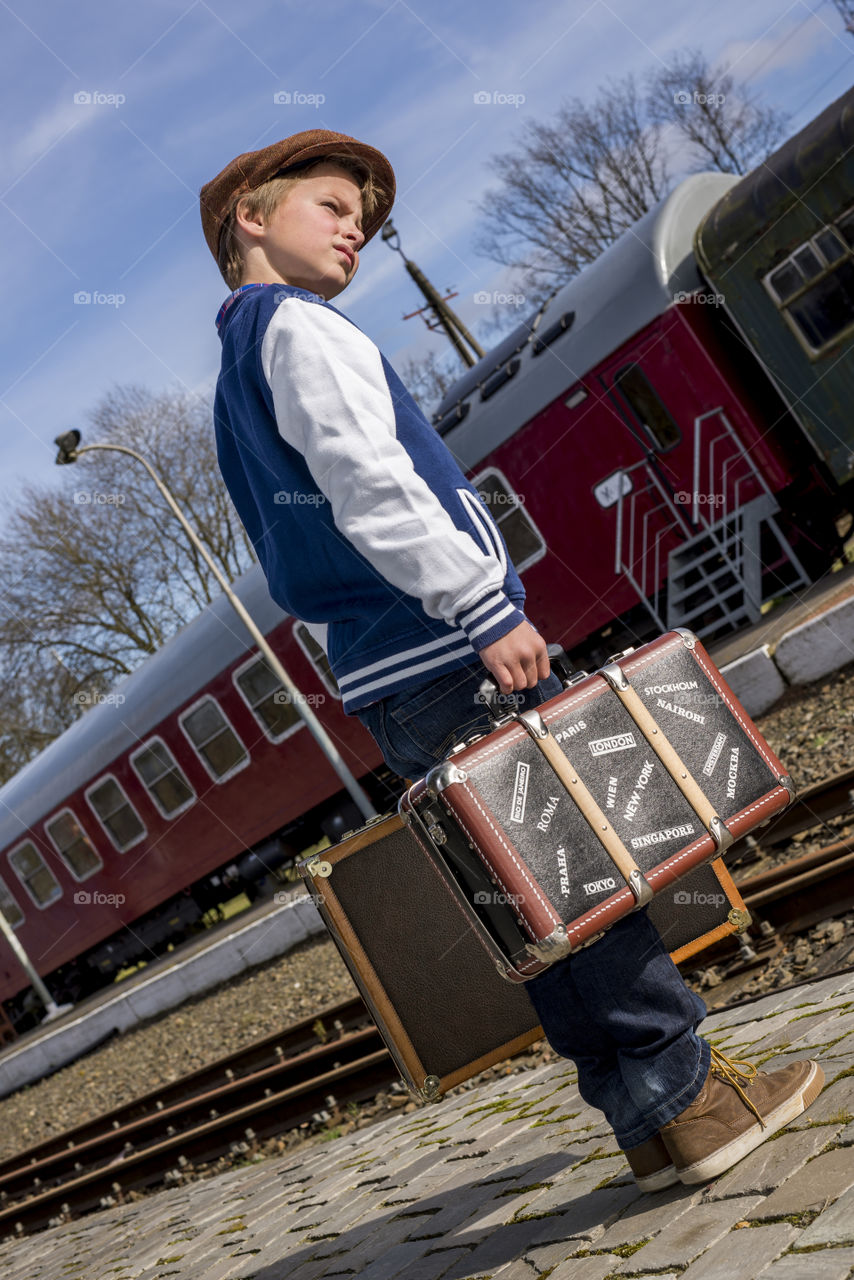 vintage boy leaving with train
