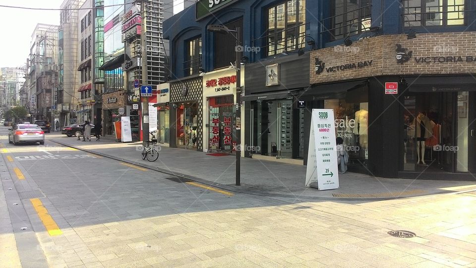 corner view of the city with shopping buildings