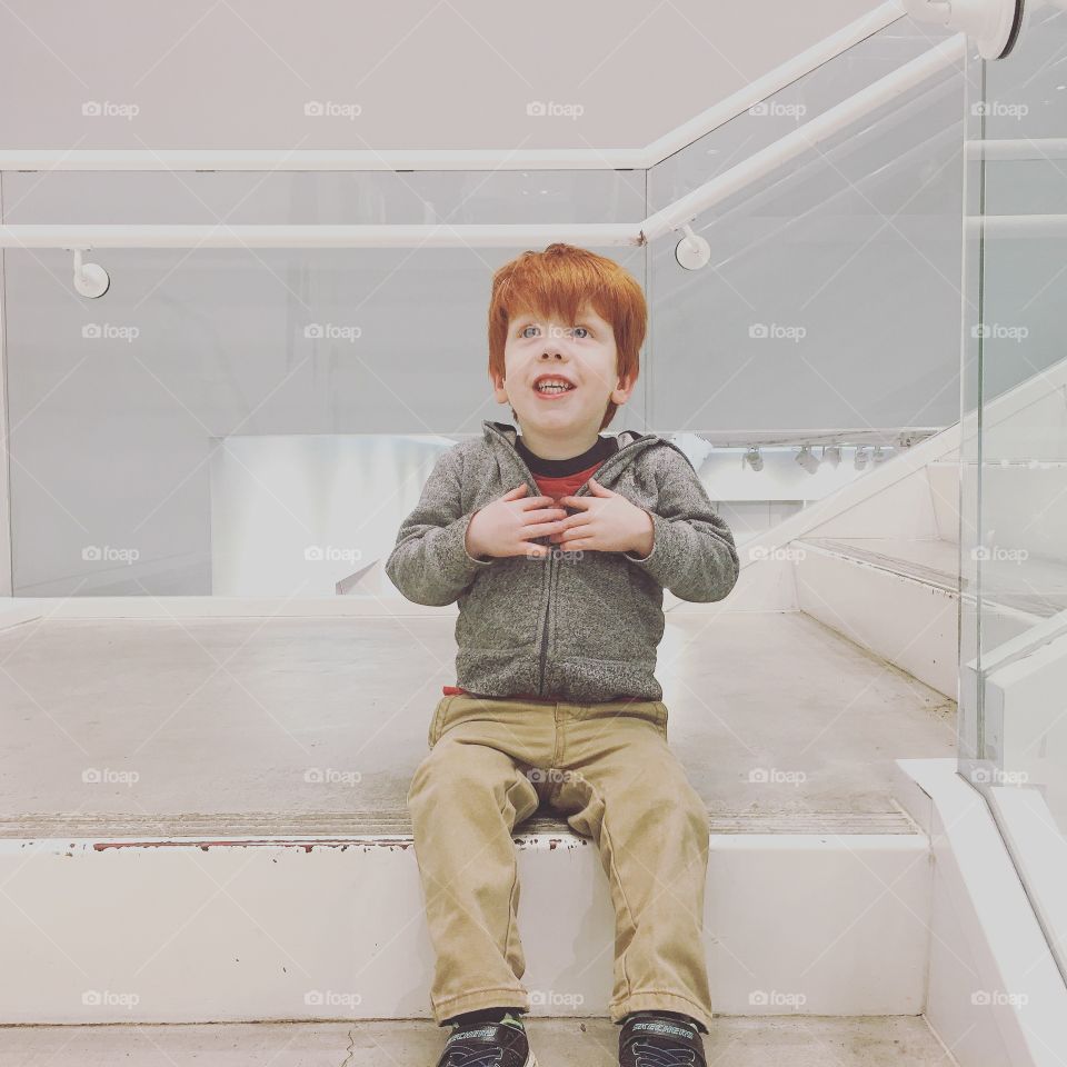Red head toddler on the stairs 