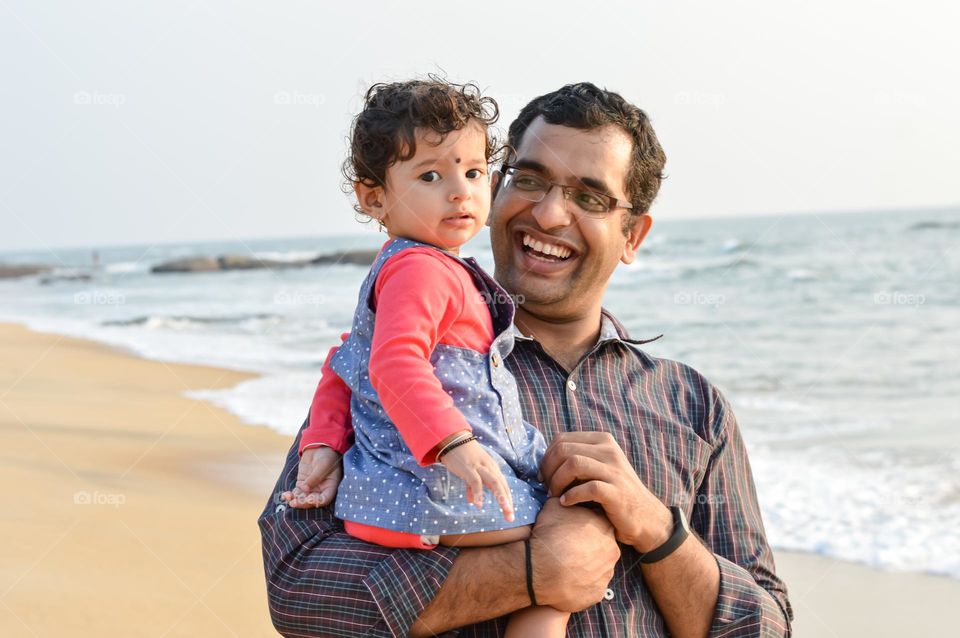 My little one's first beach day. Nothing can beat her expression on seeing huge waves.