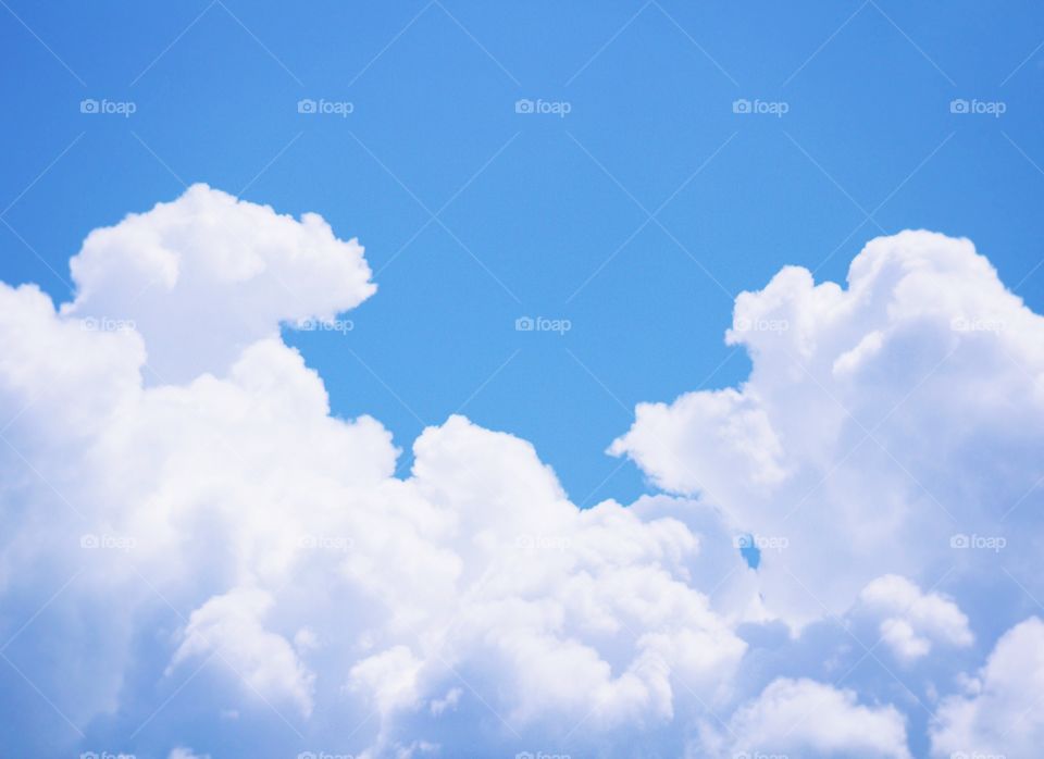 Cumulonimbus clouds against a bright summer sky