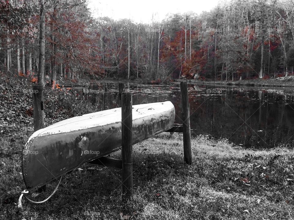 Lonely Canoe. A lonely canoe waits for Spring to return 