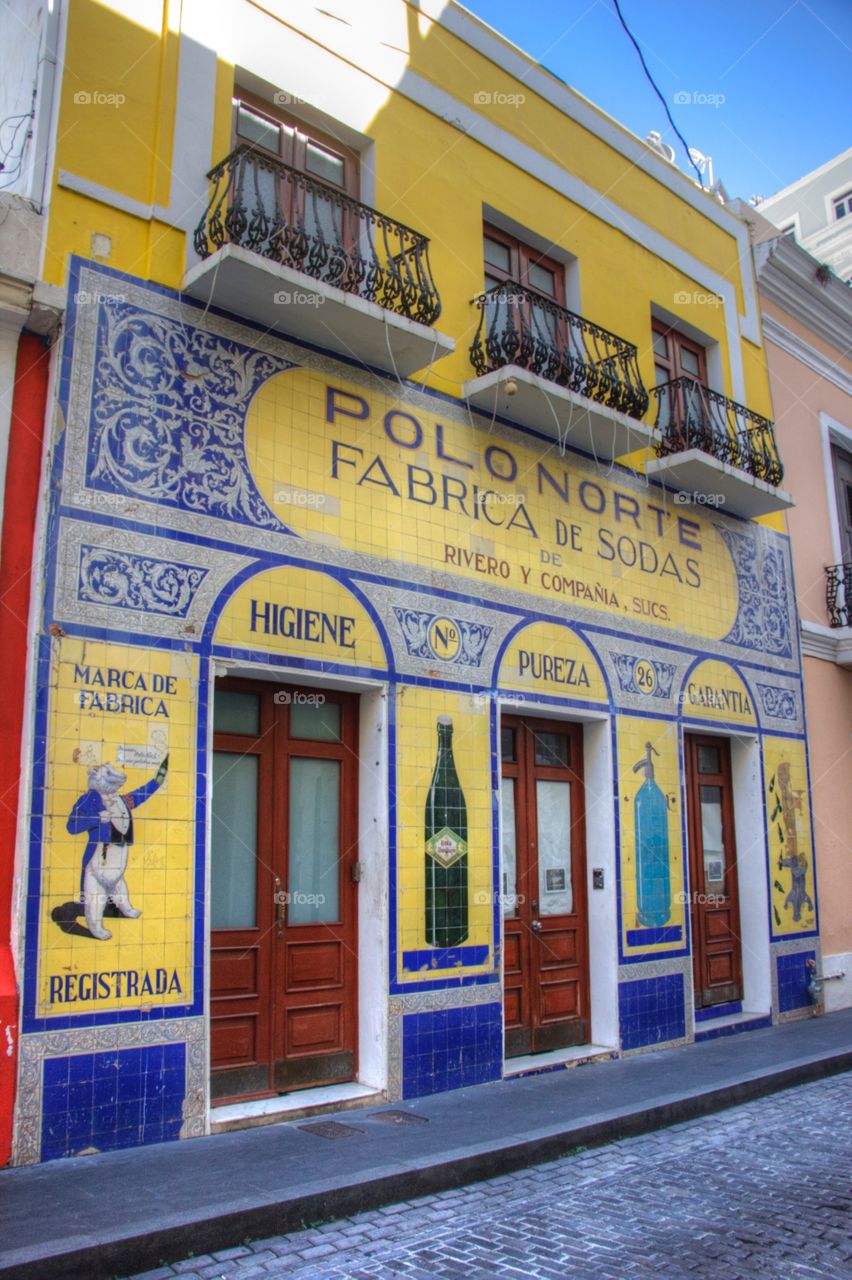 San Juan. San Juan Puerto Rico Yellow building shop colorful vendors blue 