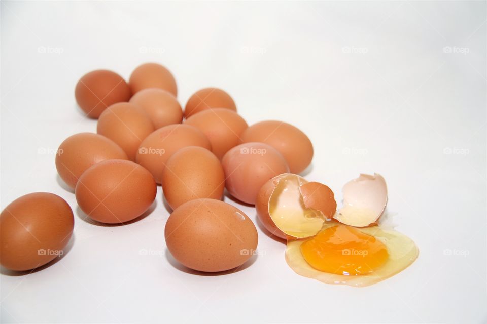 Fresh eggs over white background