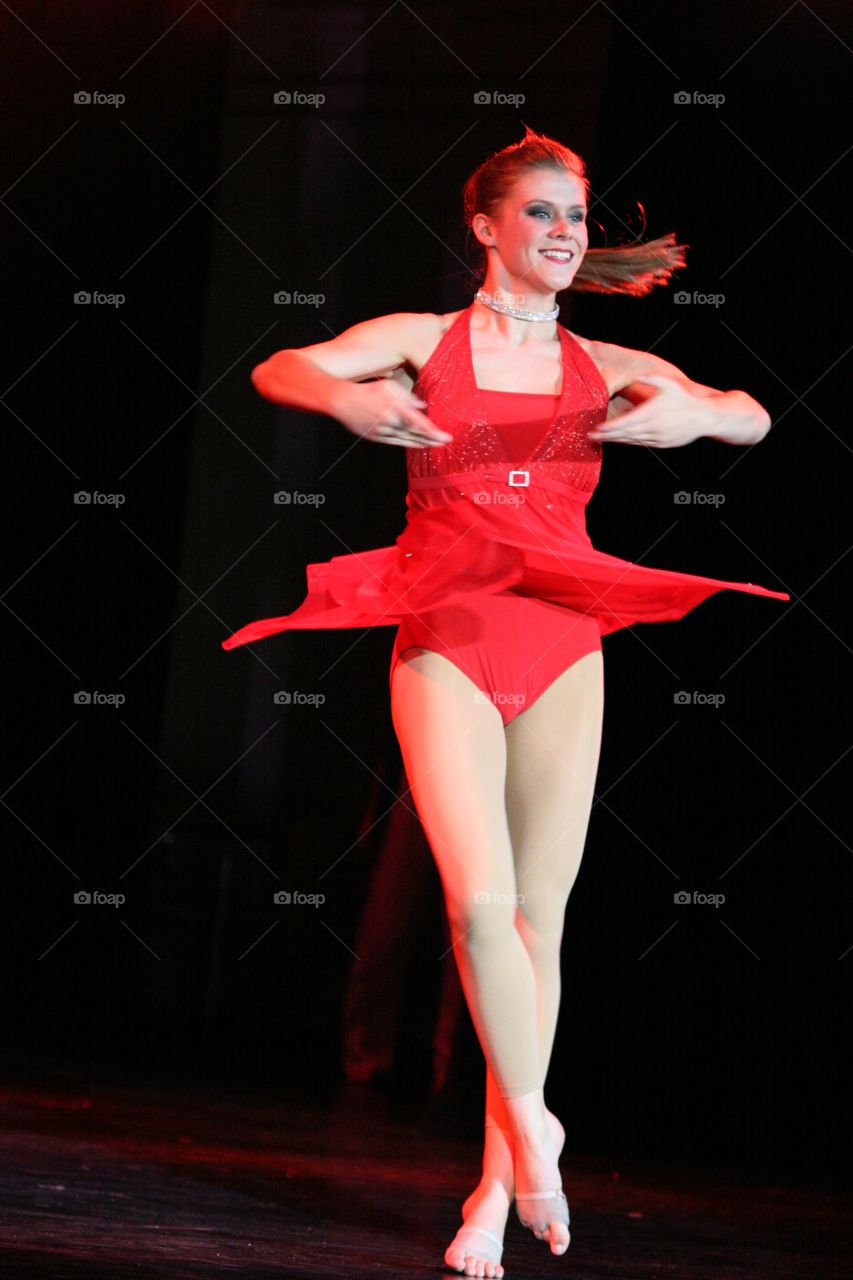Ballet dancer performance on black background