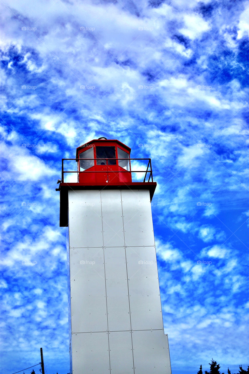 Beautiful lighthouse and sky on a summer day in New Brunswick Canada 