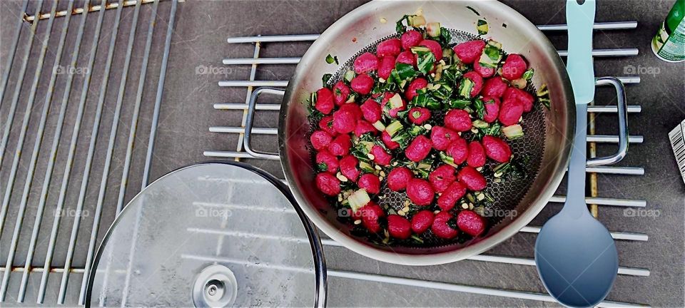 A vegetarian meal that is good for your health and celebrates Spring awaits in this large metal container. 2024. Hypnotic Productions