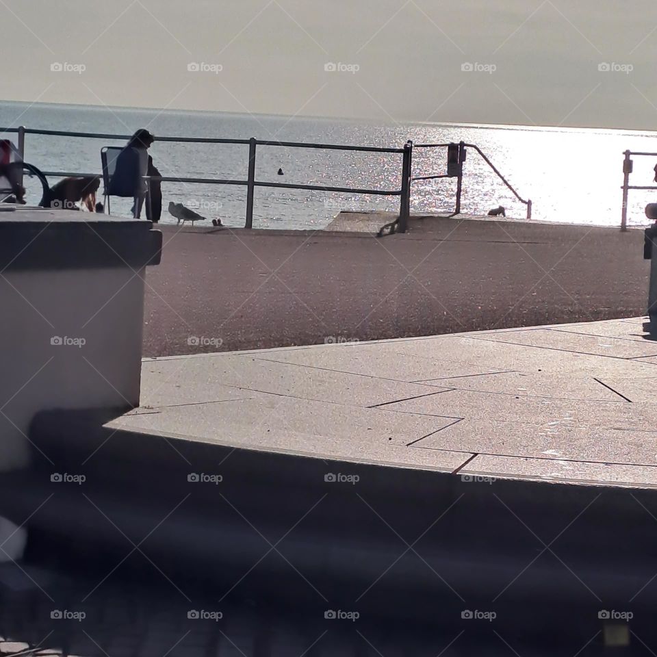 ocean wirh sun shining, promenade shaow sun