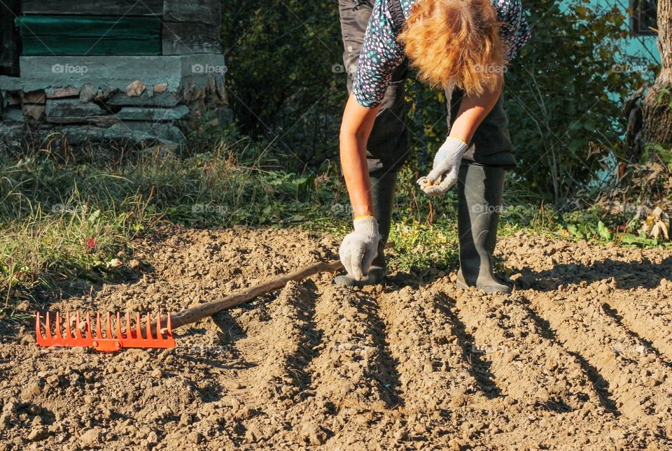 Woman planting in the garden