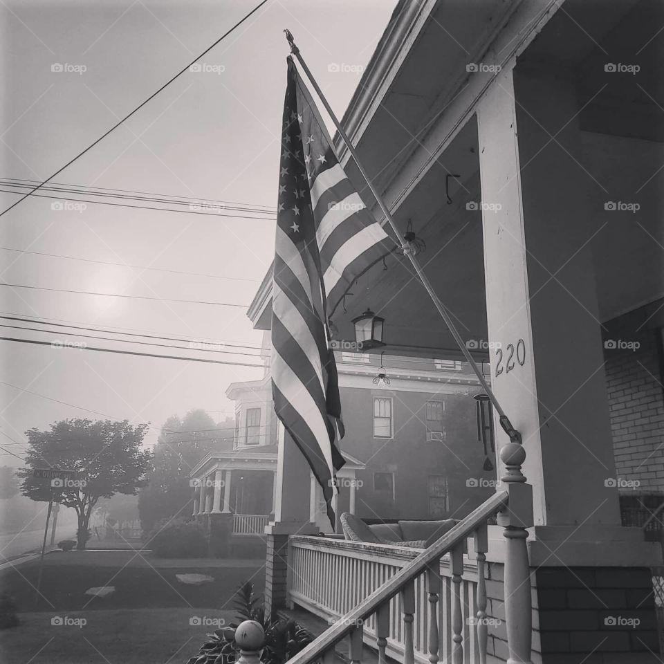 Black and white American flag on a foggy Memorial Day morning