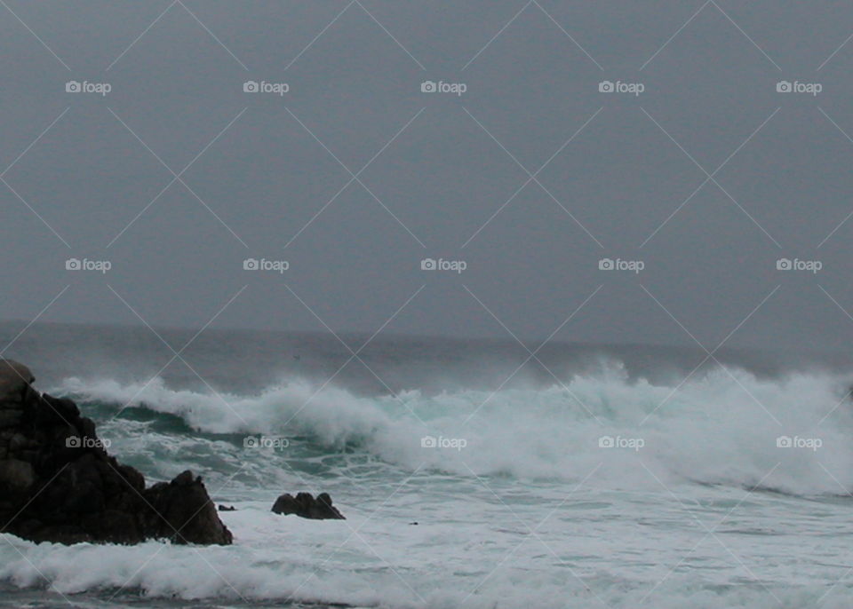 Cloudy day waves coming in