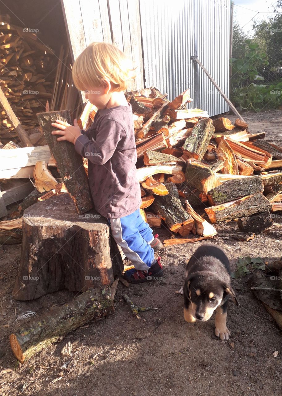 little boy and a puppy