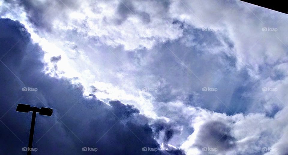 cloud formation and slight rainbow reflection