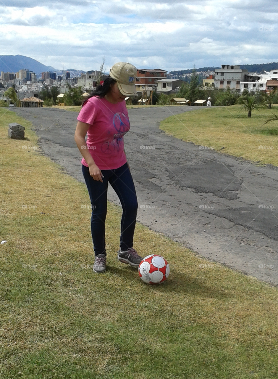 woman playing with soccer ball