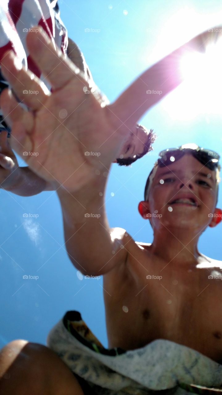 Dropped Phone. my youngest grabbed his towel after swimming not realizing my phone was on it and evidently took a pic as it fell.