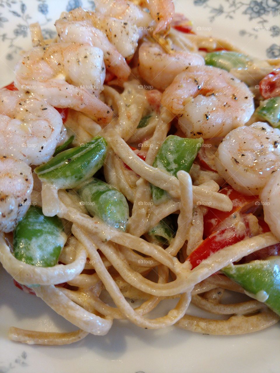Extreme close-up of pasta and shrimp
