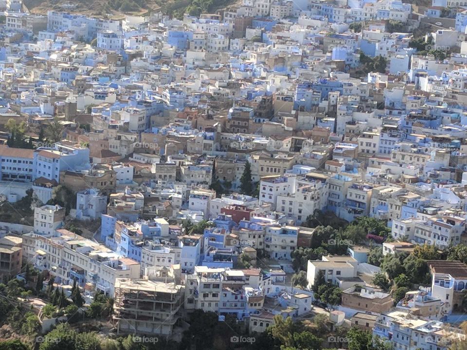 Close-Up of a View from Above (a Hike) of the Blue Buildings and Houses of Chefchaouen (the Blue City) in Morocco