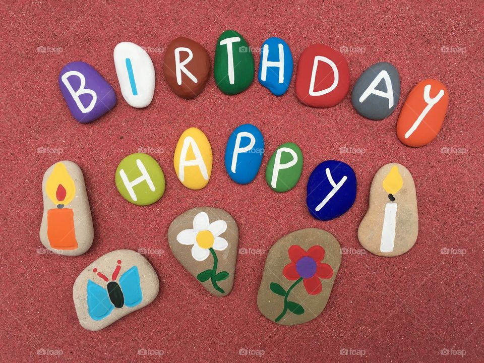 Happy birthday massage on pebble stone