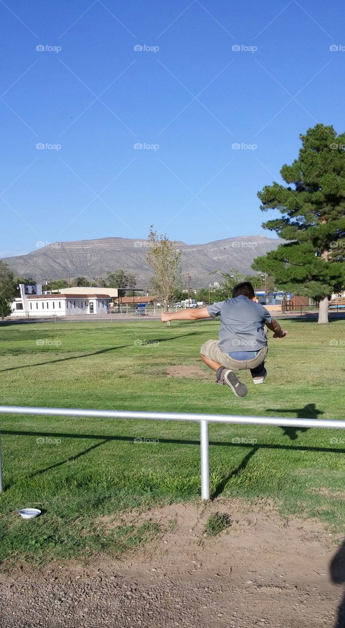 jumping high over a rail