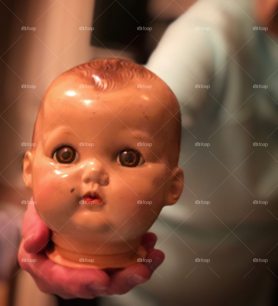 Being offered the head of a vintage babydoll 