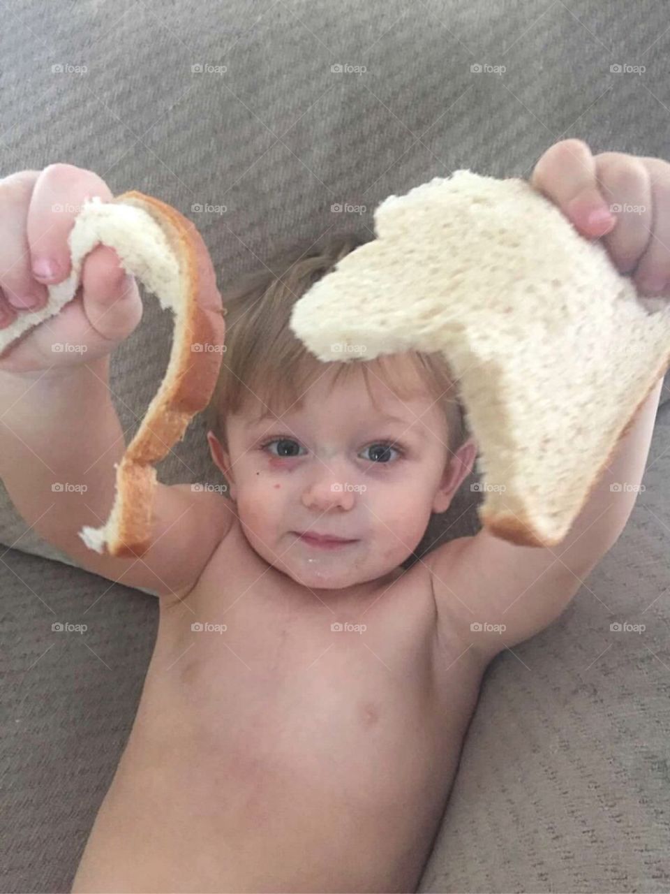 High angle view of boy holding bread