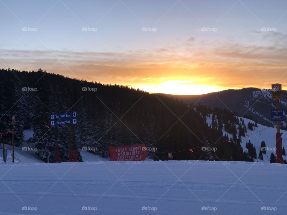 Beautiful sunshine and sunset on top of the mountain on a snow mountain in Colorado 