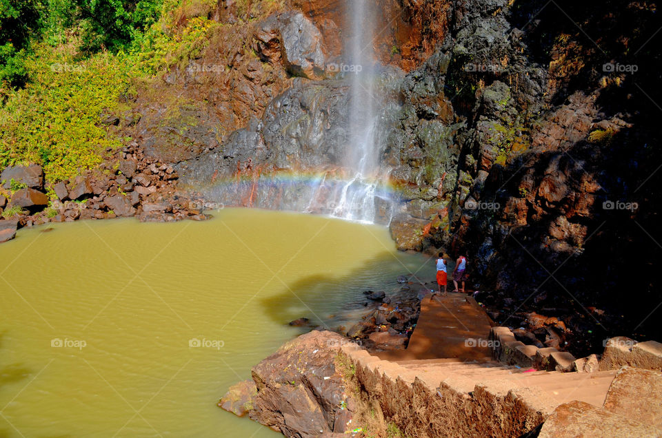 people enjoying waterfall