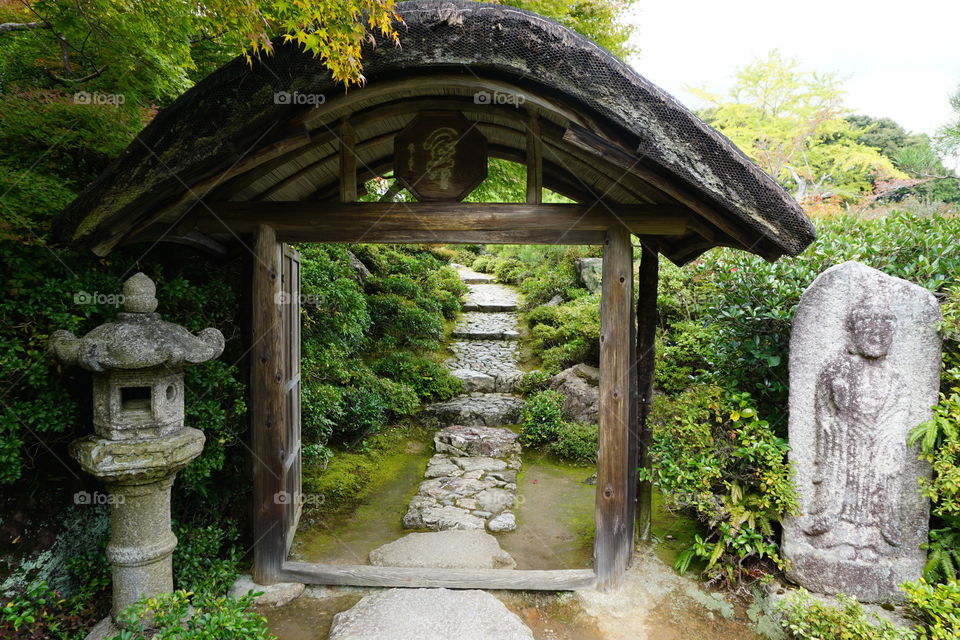 Garden entrance with stone lantern and sculpture