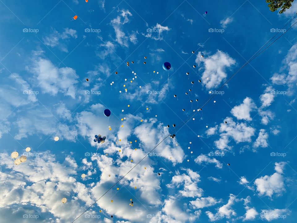 balloons flying high in the sky