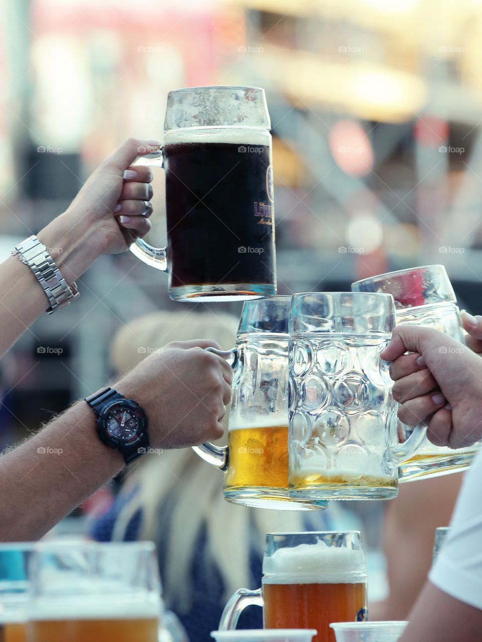 Beer glasses in the human hands 