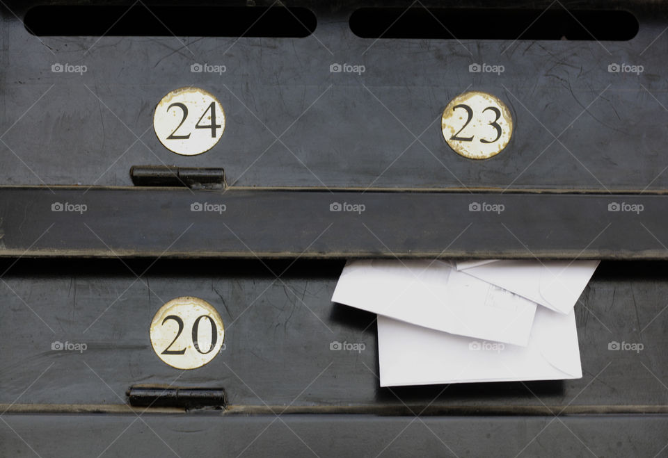 Metal postal boxes with metal numbers and envelopes. Love message.