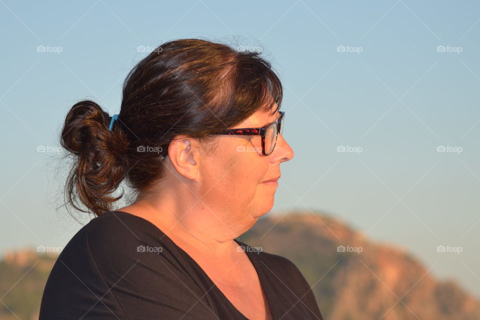 woman on the beach in the last hour of sunlight.